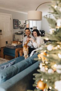 Family on the couch with cat during lifestyle newborn session