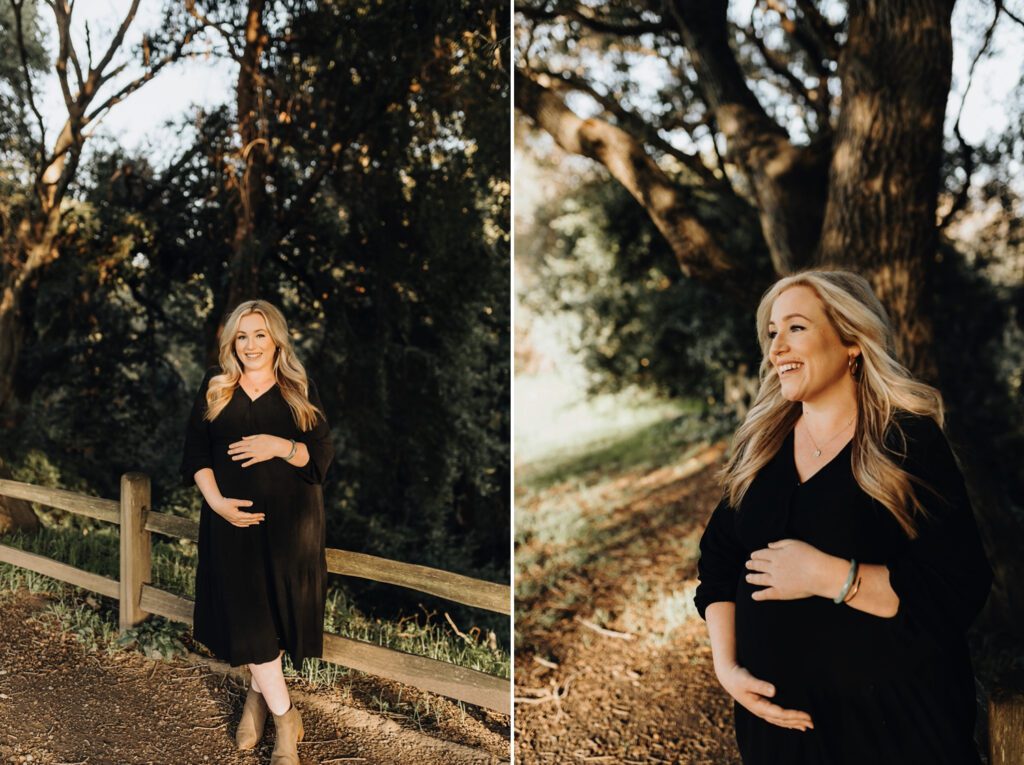 A pregnant mom in her third trimester smiles holding her belly at Crow Canyon Gardens. 