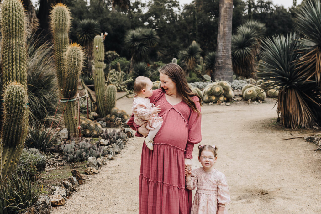 Mom and her girls when she is pregnant with her third girl.