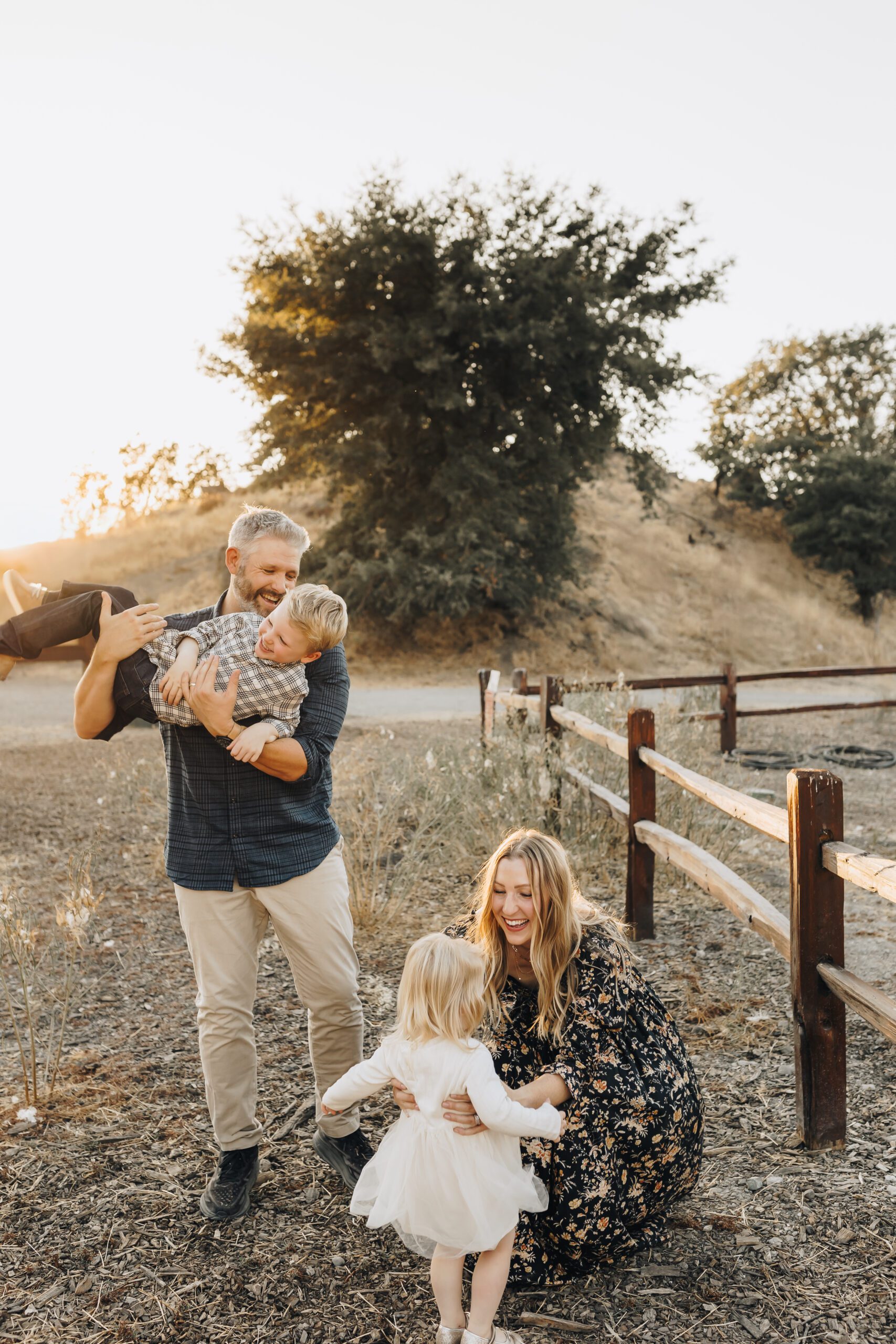 Mom and Dad play with kids during a kid-led family photography session in Walnut Creek